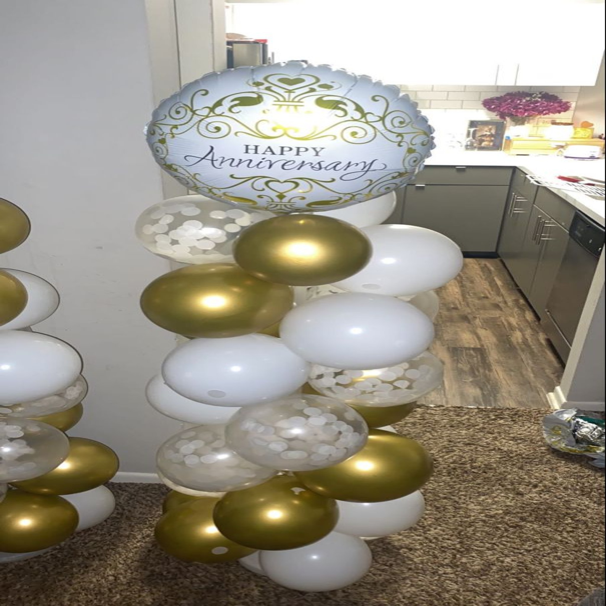 Golden Elegance: Anniversary Balloon Column Tower