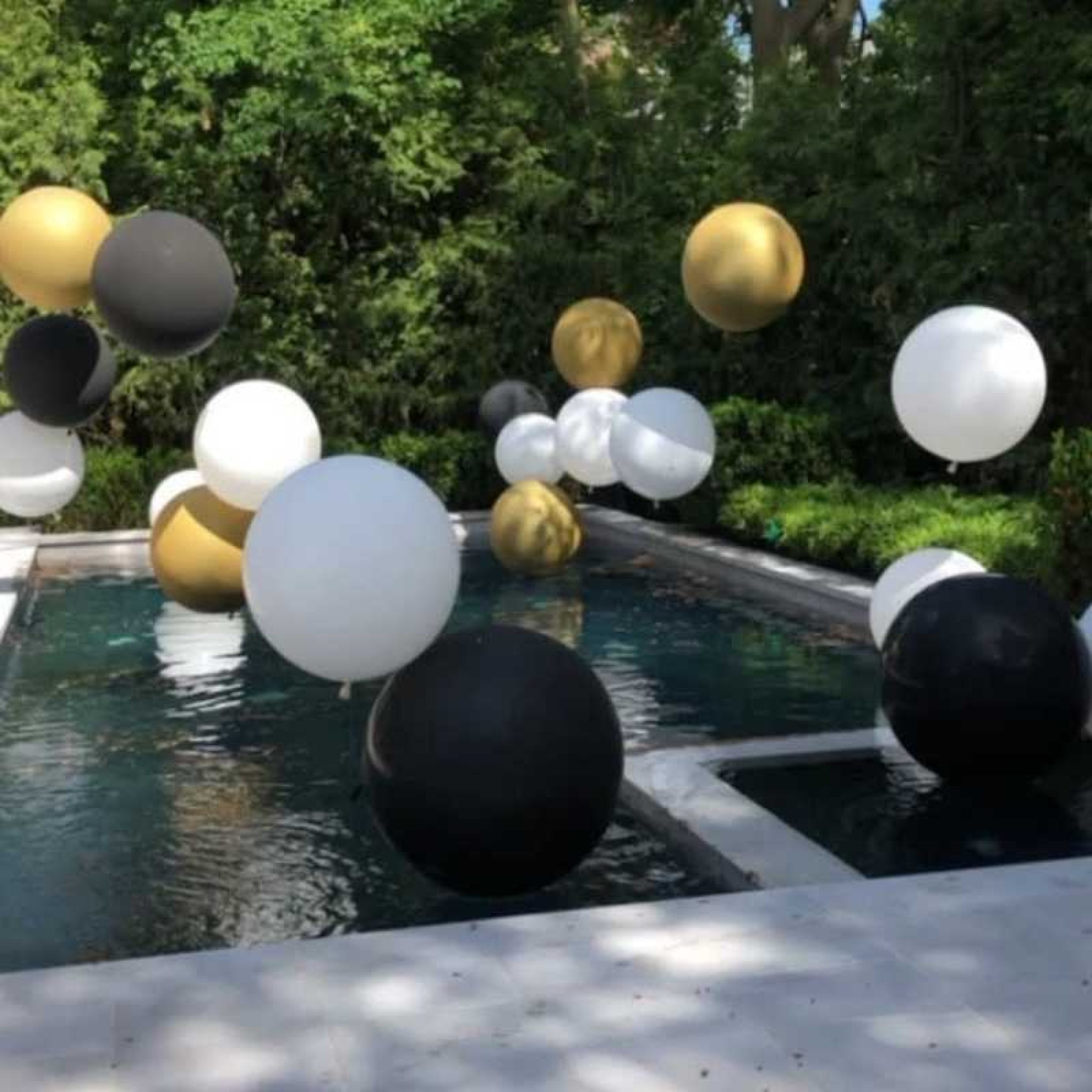 Luxury Floating Pool Balloon Decoration â€“ Black, White & Gold Event Styling